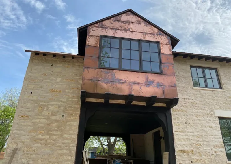 Copper metal panel facade on a stone building for Metal Roof Coating in Deale